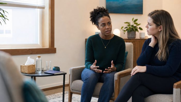 Two women in conversation together in a counselling setting